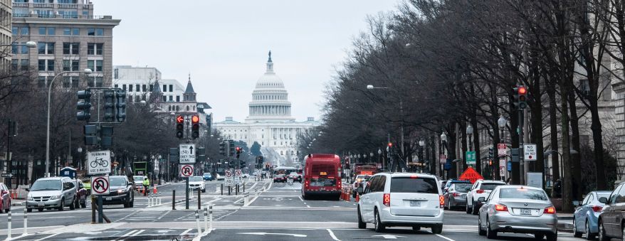 Street view of Washington D.C. with the capital building in the background